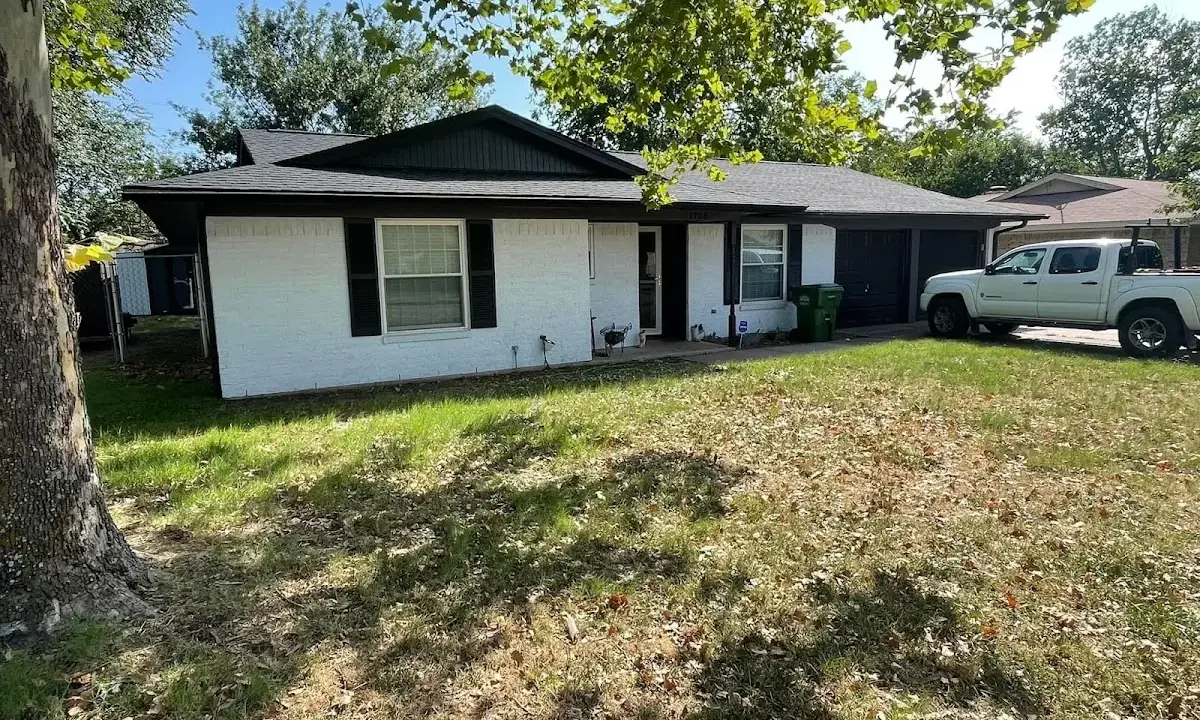 Professional roofing crew working on a residential roof in Minnetonka